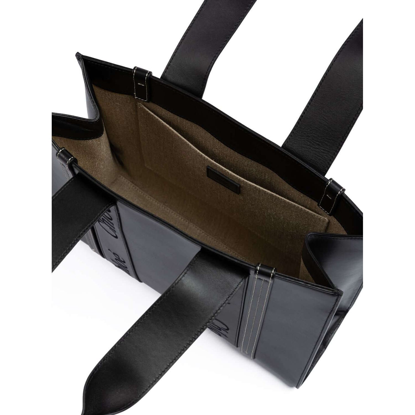 Interior view of Chloé Black Woody Embroidered Logo Leather Medium Tote Bag with spacious compartments and leather handles.