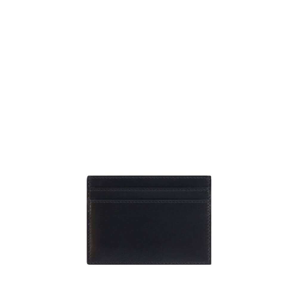 Saint Laurent Black Calf Leather Bos Taurus Wallet with card slots and embossed brass logo, showcasing luxury and style. AW25 Collection.