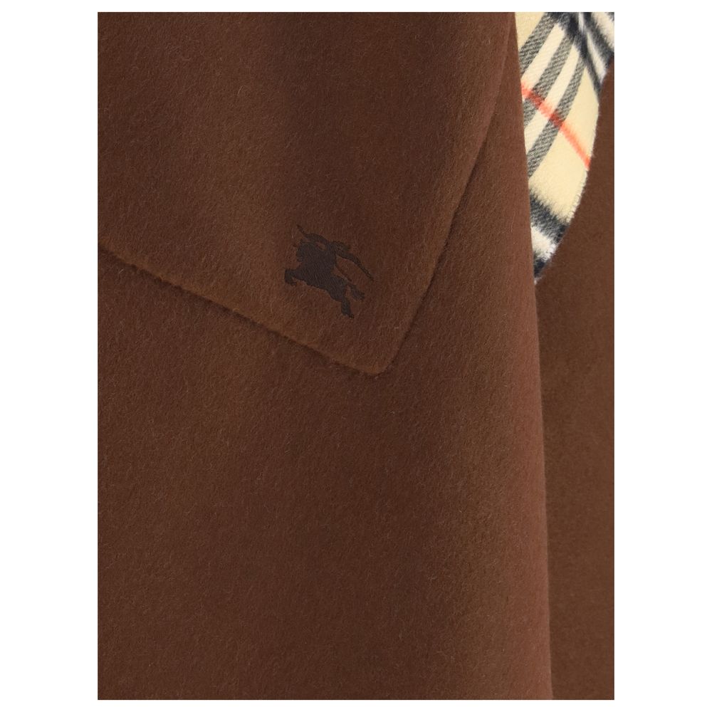 Close-up of Burberry Brown Cashmere Coat with Equestrian Knight embroidery and Burberry Check pattern, reversible cape design.