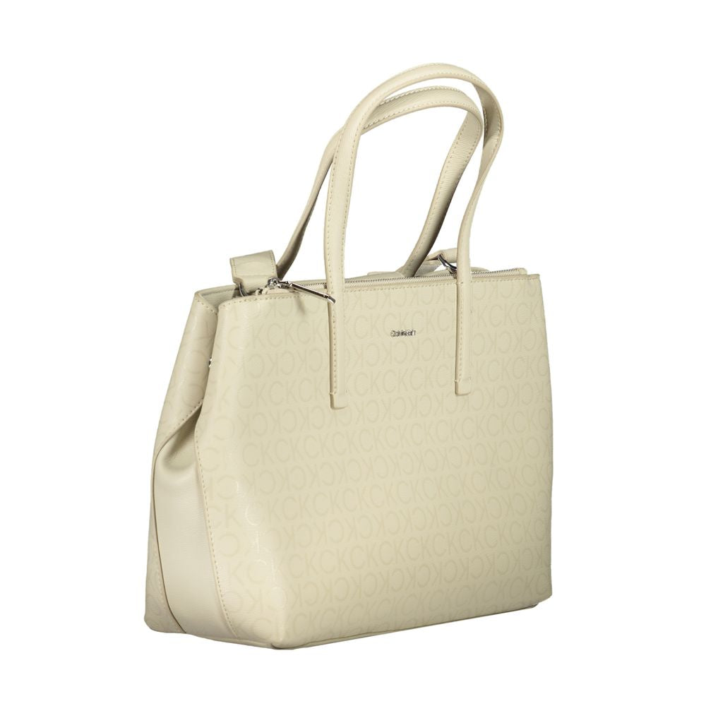Calvin Klein Beige Polyester Handbag with adjustable shoulder handle, internal pocket, contrasting details, and zip closure.