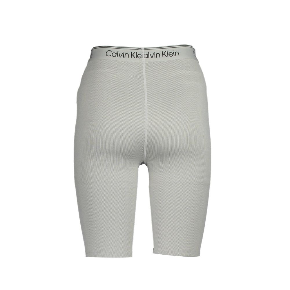 Calvin Klein Gray Polyester Pant featuring short gym shorts style, elastic waistband, and contrasting details with logo print.