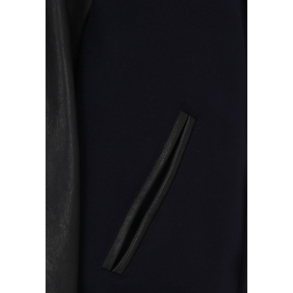 Close-up of side slit pocket on Golden Goose Blue Wool Bomber, featuring ribbed detailing and leather accents.