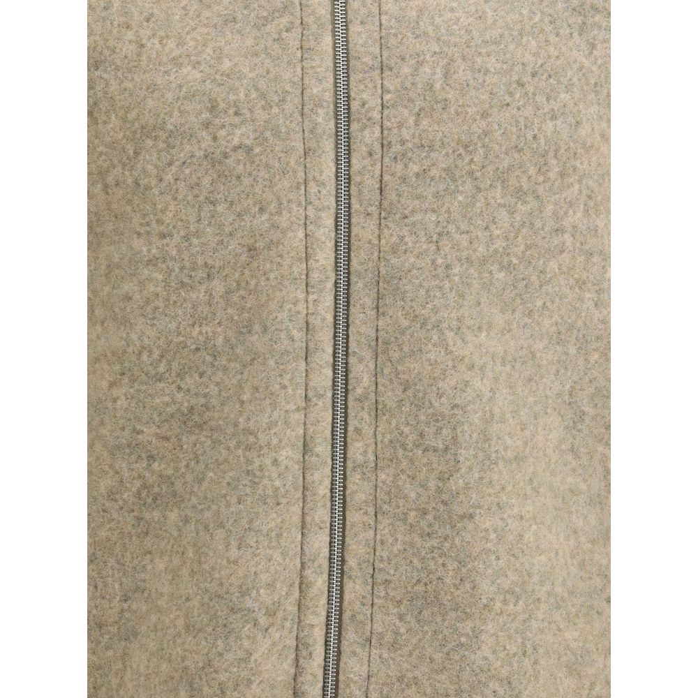 Close-up of Jil Sander Beige Wool Coat showing front zipper detail and soft texture for a modern, minimalist style.