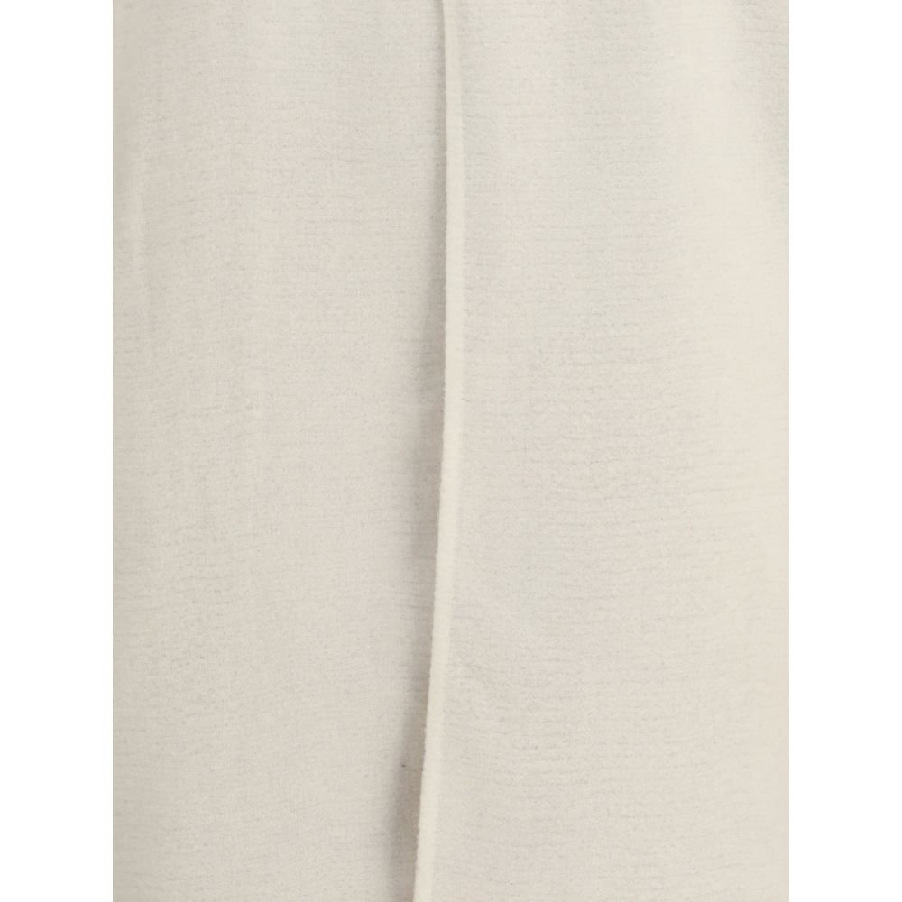 Close-up of Rick Owens Cream Camel Hair Coat showing the off-white asymmetrical front overlay and straight hem, AW25 season.