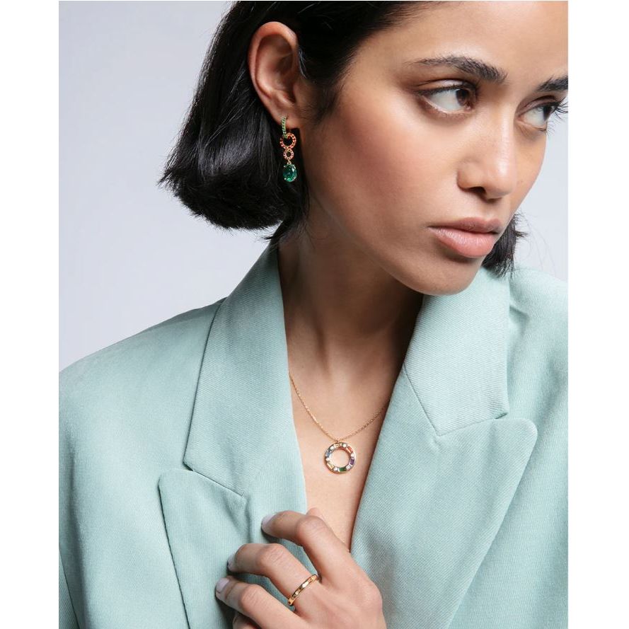Fashionable woman wearing Viceroy Jewels earrings and necklace, showcasing elegant style and luxury jewelry.
