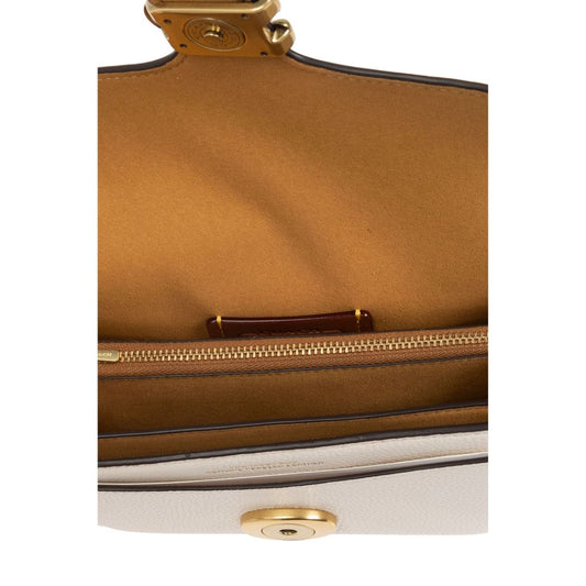Interior view of Coach Tabby 20 leather crossbody bag showing multifunctional pockets and zip closure.