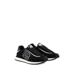 Dolce & Gabbana Sneakers Black with branded heel counter and logo patch. Front lace-up and rubber sole DG Cushion sneakers.