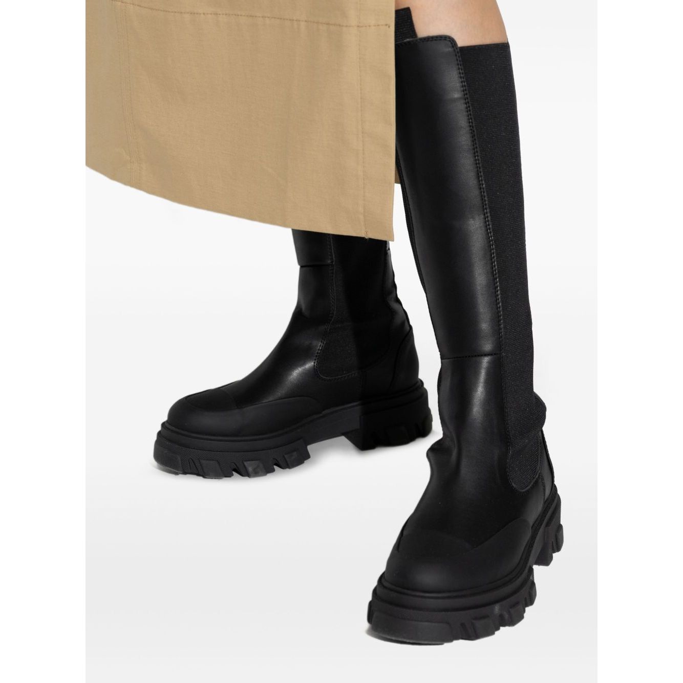 GANNI Boots Black with faux-leather upper, elasticated side panels, chunky lug sole, and round toe, showcasing a high Chelsea style.