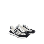 Dolce & Gabbana Sneakers White with front lace-up, rubber sole, branded heel, and logo patch. Stylish and sporty footwear.