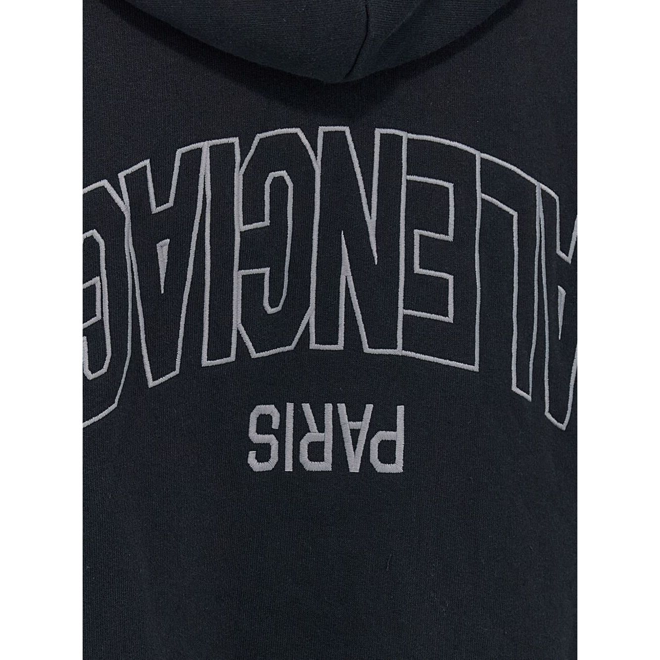 Back embroidery of Balenciaga Sweaters Black hoodie with flipped logo and dropped shoulders.