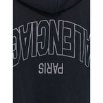 Back embroidery of Balenciaga Sweaters Black hoodie with flipped logo and dropped shoulders.