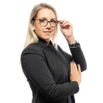 Woman wearing Ted Baker Brown Women Glasses Frame with square full-rim design, no lenses effect, in a professional setting.