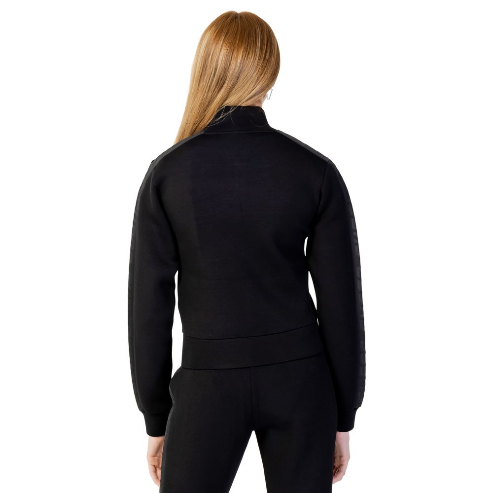 Front view with bag zipped and handles upright.