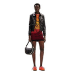 Woman wearing Desigual Red Viscose Midi dress from Spring/Summer collection with black jacket and handbag