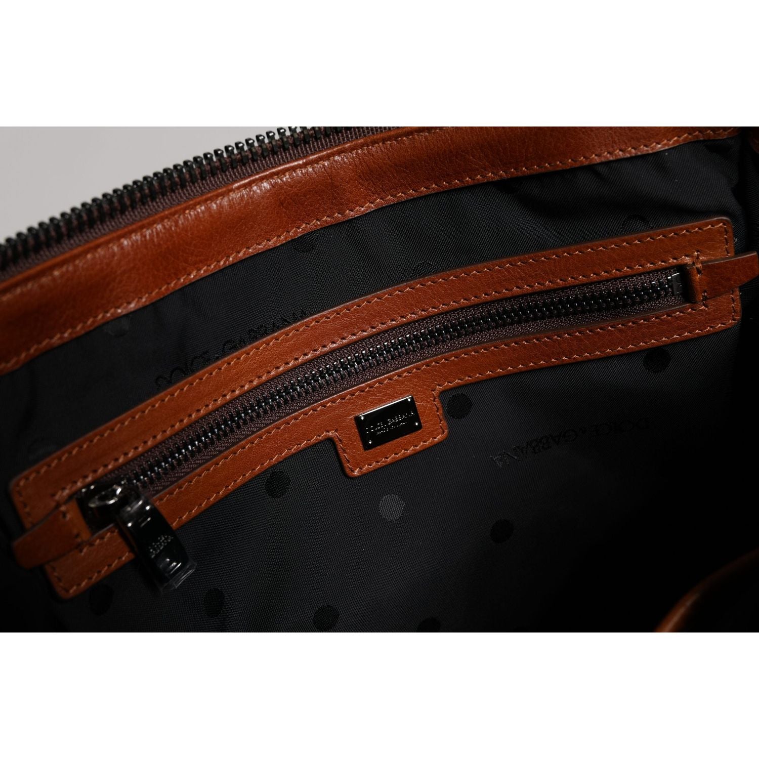 Front view with bag zipped and handles upright.