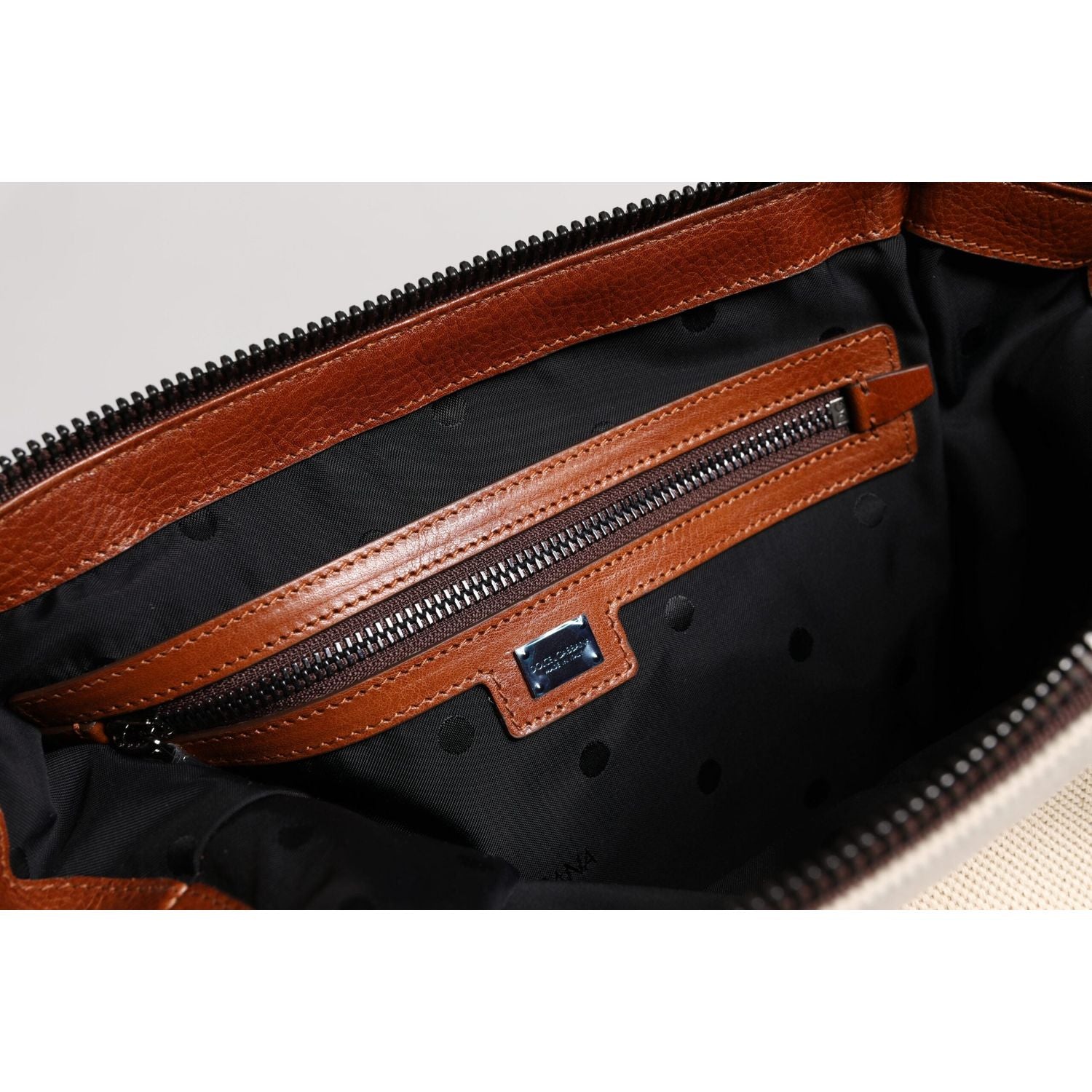 Front view with bag zipped and handles upright.
