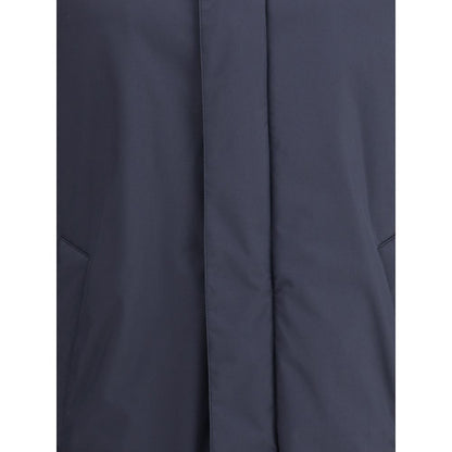 Close-up of a Herno Blue Goose Down Coat showing technical fabric and pocket detail.