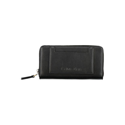 Calvin Klein Black Polyester Wallet with contrasting details, zip closure, logo, 5 compartments, card spaces, and coin purse.