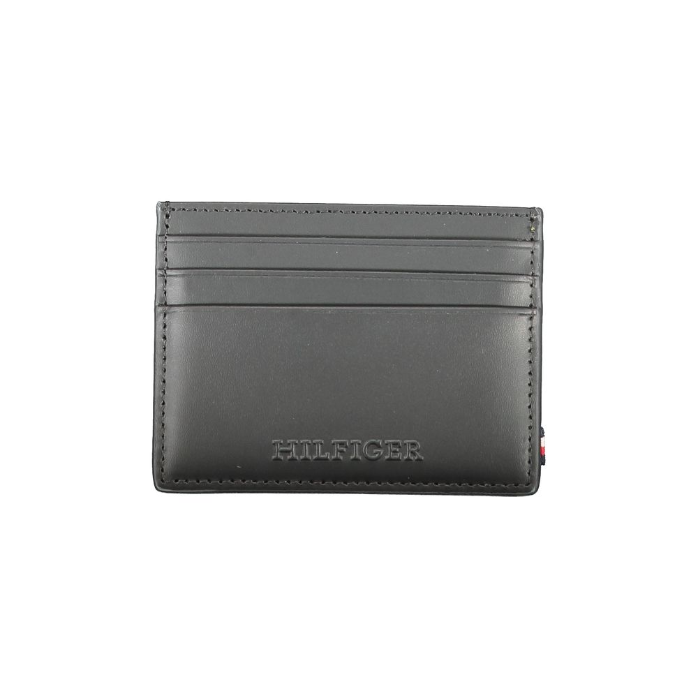 Tommy Hilfiger Black Leather Wallet with card holder, central pocket, spaces for cards, contrast details, and logo.