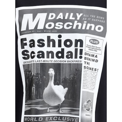 Moschino Black Cotton T-Shirt featuring a bold newspaper print with dramatic headlines, showcasing the brand's iconic monogram.