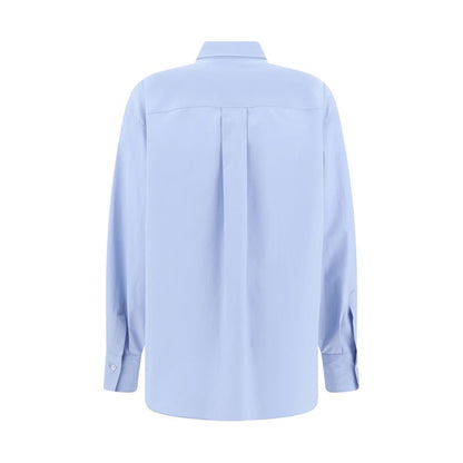 Back view of Brunello Cucinelli Light Blue Cotton Dress Shirt with classic collar and buttoned cuffs, featuring a pleated design, AW25.