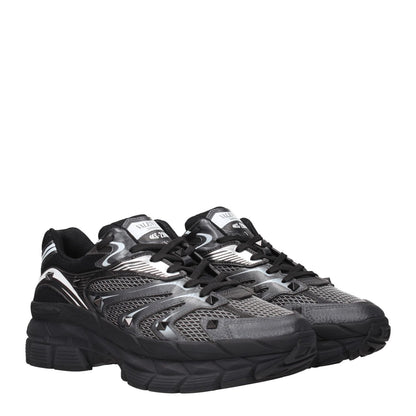 Valentino Garavani Black Fabric Athletic Sneakers with studs and logos, round toe, lace-up closure, and 5 cm mid heels.