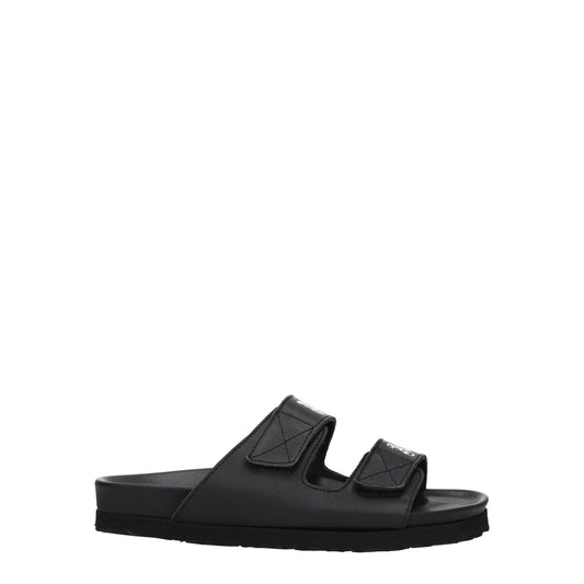 Palm Angels Black Leather Flat Sandals with strap closure and front logo, featuring low flat heel and rubber sole.