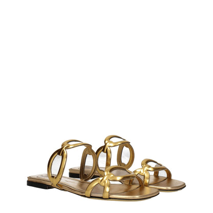 Valentino Garavani Gold Leather Slippers with open toe design and low flat heel, showcasing casual luxury in gold leather.
