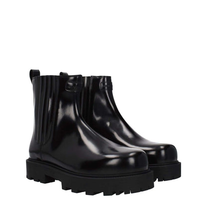 Givenchy Black Leather Ankle Boots with a round toe, mid heels, rubber sole, featuring front and back logos, style casual.