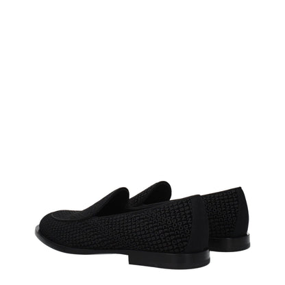 Dolce & Gabbana Black Velvet Slip-On Loafers with leather sole and round toe, low flat heel, featuring logo design.