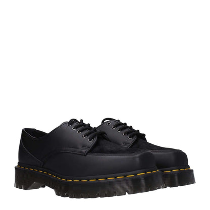 Dr. Martens Black Leather Oxfords And Derbies, casual lace-up shoes with rubber sole and mid heels, square toe, black leather upper.