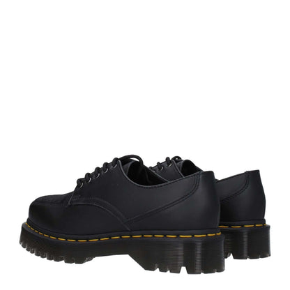 Dr. Martens Black Leather Oxfords And Derbies with lace up design, rubber sole, and square toe, featuring mid heels in a casual style.