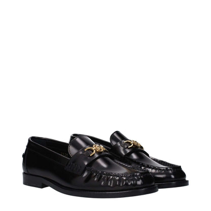 Versace Black Leather Slip-On Loafers with front detail and logo, featuring round toe and low flat leather sole for casual style.