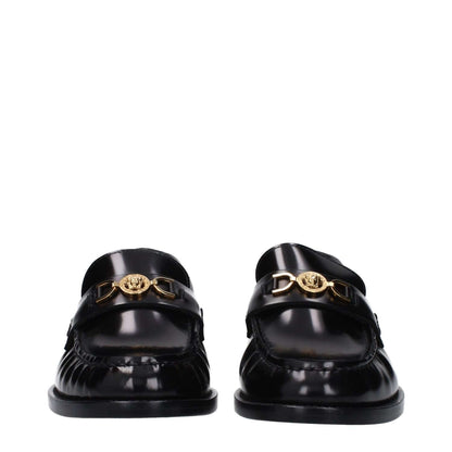 Versace Black Leather Slip-On Loafers with front logo and low flat heel.