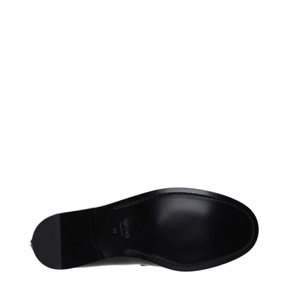 Sole view of Versace Black Leather Slip-On Loafers with leather sole and round toe design.