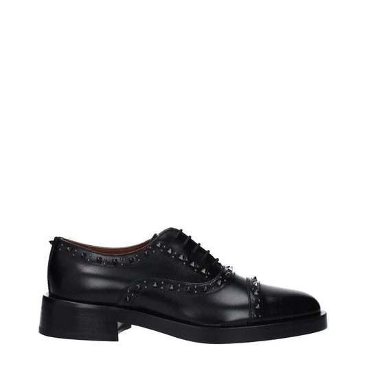 Valentino Garavani Black Leather Oxfords And Derbies with lace-up and monkstrap design, featuring studs and round toe mid heels.