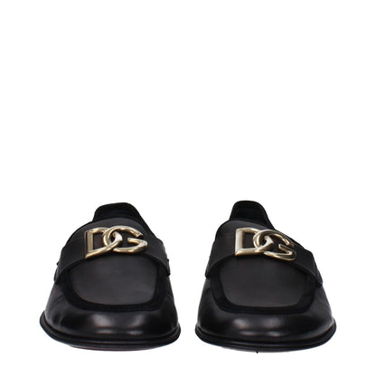 Dolce & Gabbana Black Leather Slip-On Loafers with front logo, round toe and flat heel, made from premium leather. MPN A50462AQ99380999.