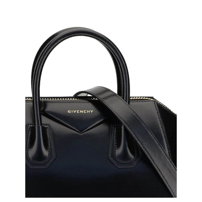 Givenchy Black Calf Leather Bos Taurus Handbag with gold embossed signature and metallic details.