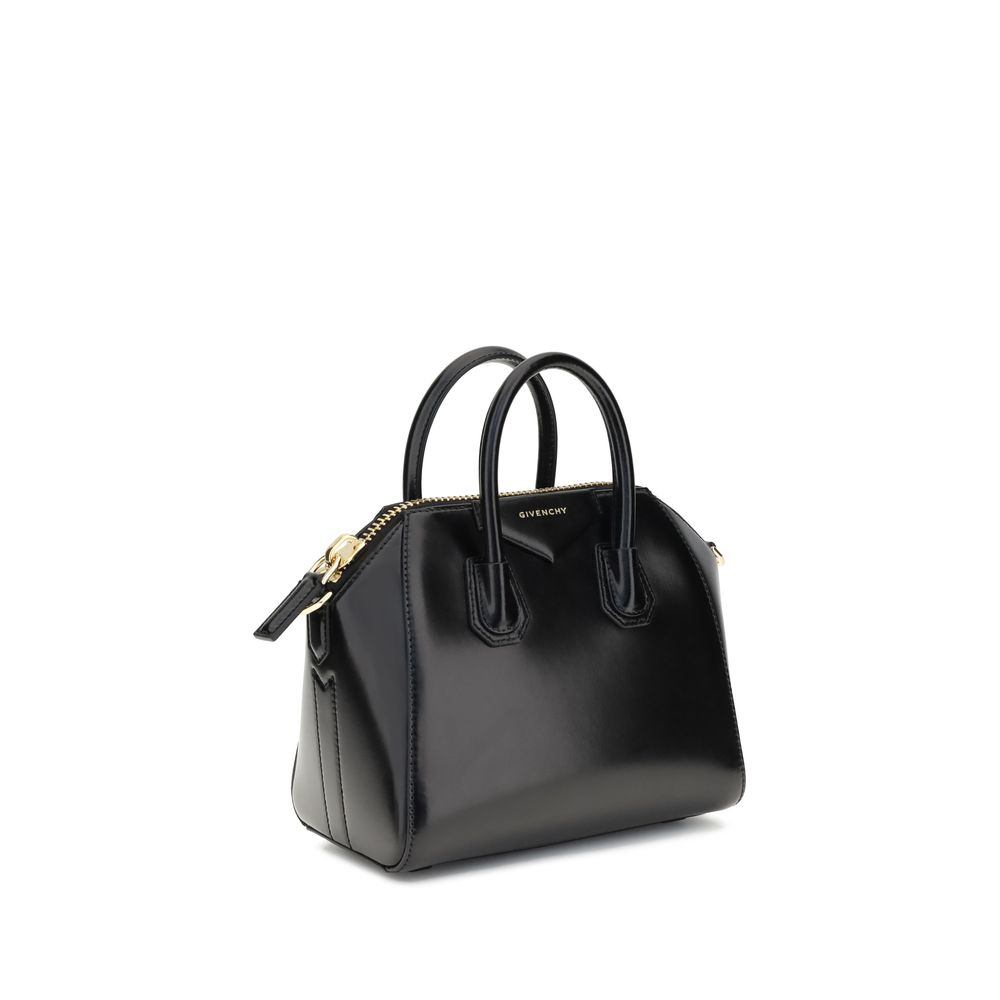 Givenchy Black Calf Leather Bos Taurus Handbag with glossy finish, geometric pattern, and detachable shoulder strap.