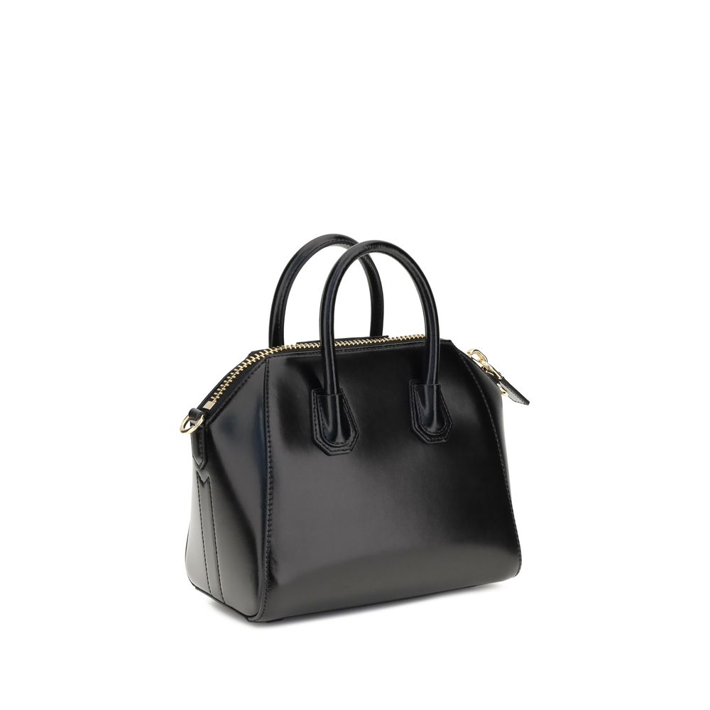 Givenchy Black Calf Leather Bos Taurus Handbag with geometric pattern, two top handles, and adjustable shoulder strap.