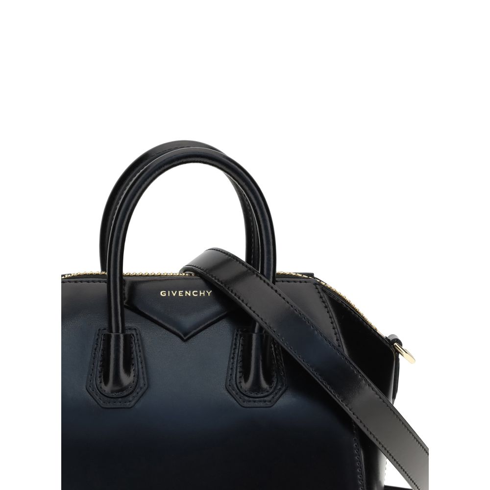 Givenchy Black Calf Leather Bos Taurus Handbag with glossy design and geometric pattern, featuring top handles and iconic brand monogram.