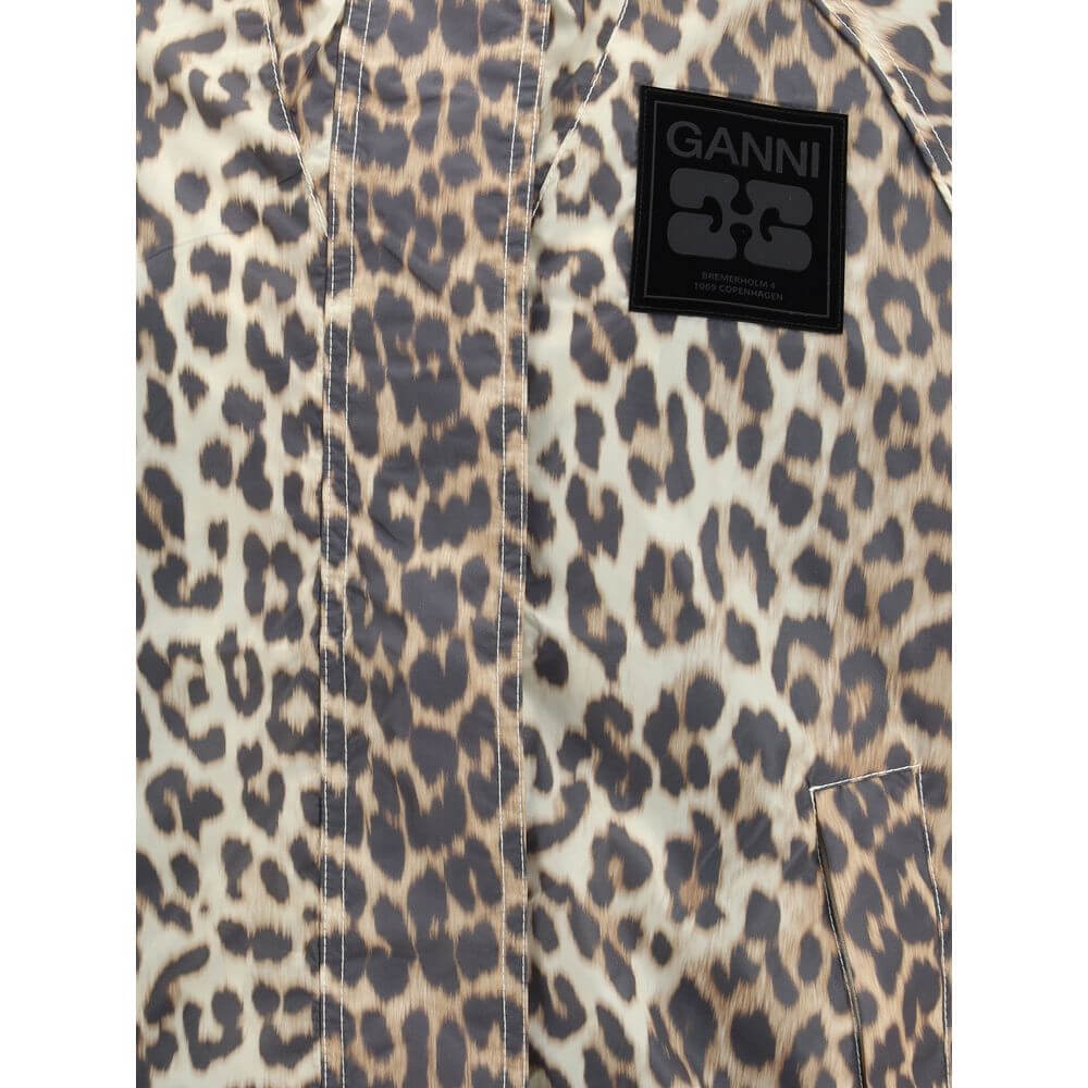 Leopard print detail of Ganni Multicolor Nylon Rain Coat with logo patch on chest, featuring zipper closure and pockets.