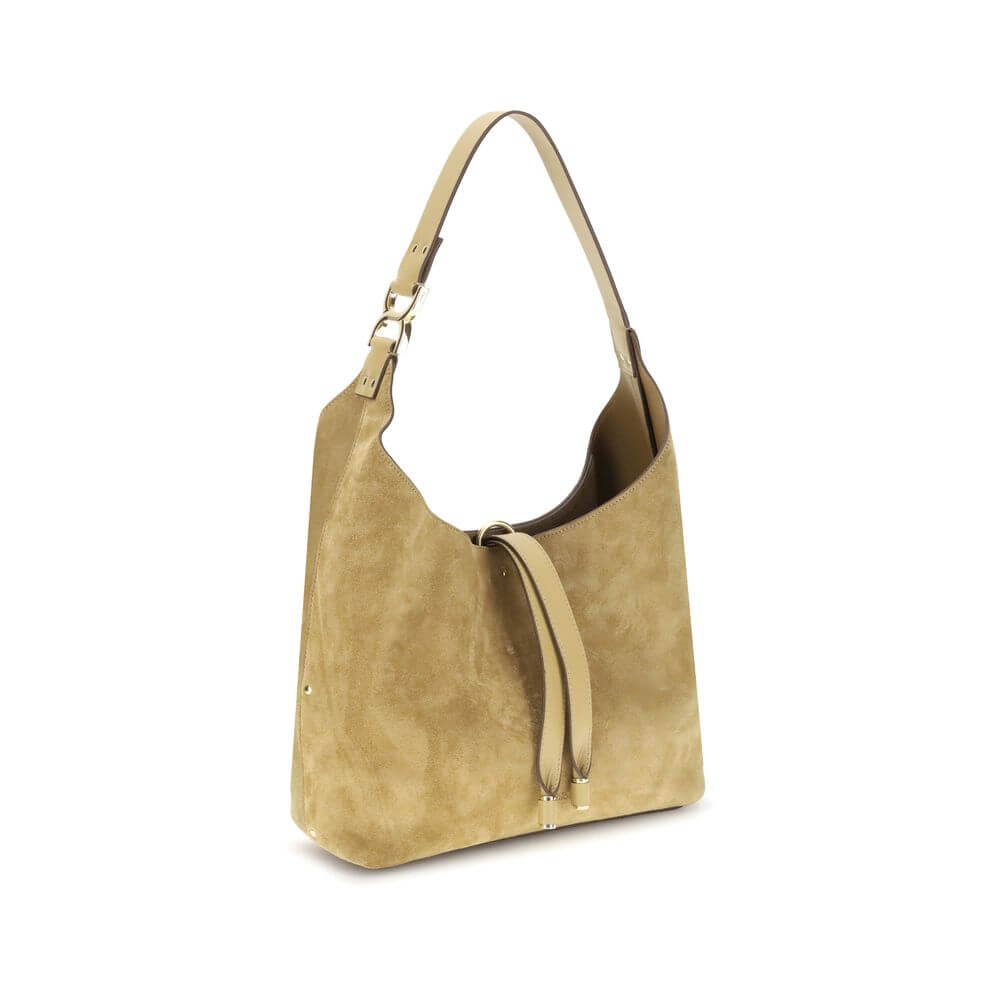 Alt Tag: Chloé Beige Calf Leather Bos Taurus Shoulder Bag with elegant design, golden metallic element, and tasseled closure.