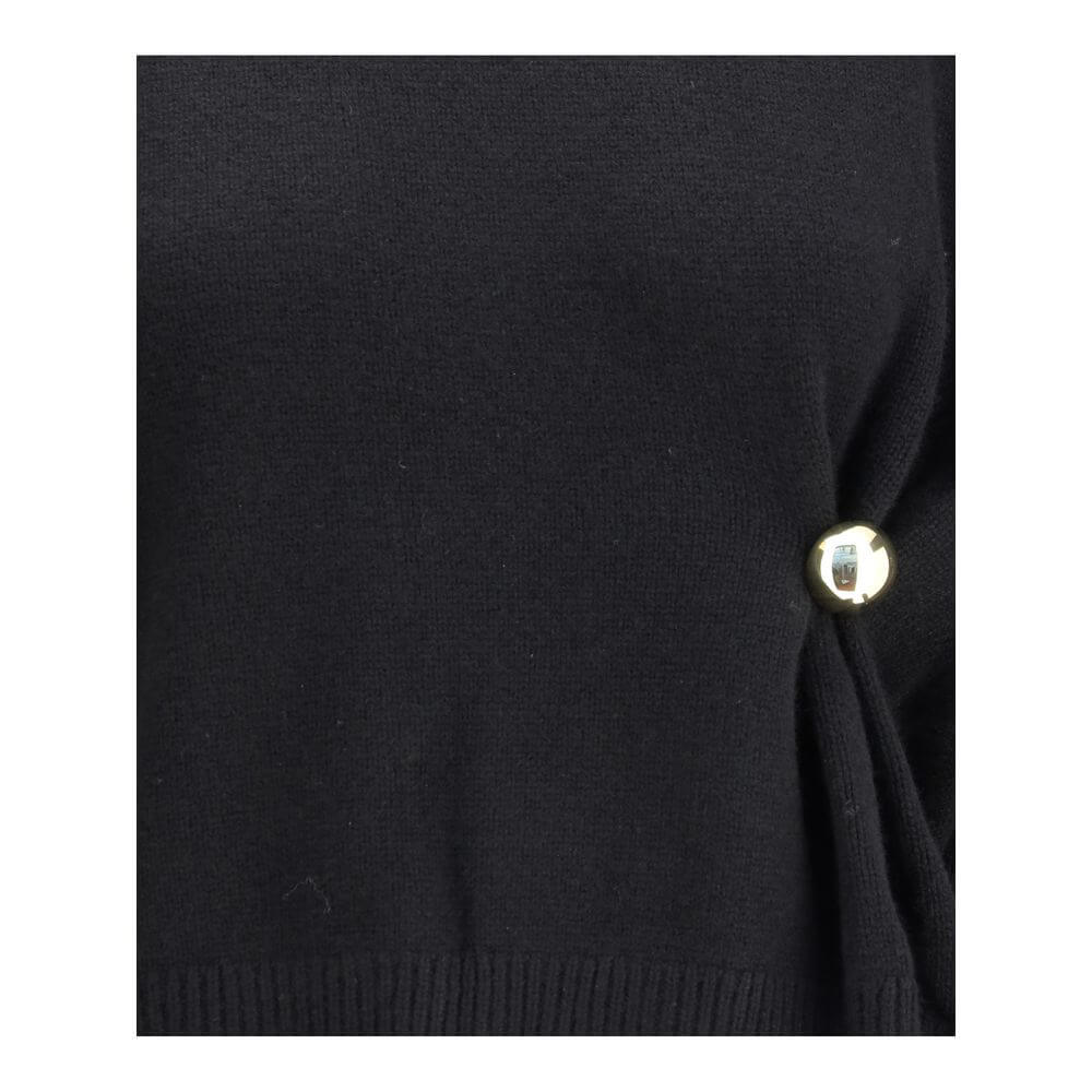 Close-up of Loulou De Saison Black Wool Sweatshirt featuring gold detail, elegant draped design, and sophisticated craftsmanship, perfect for AW25.