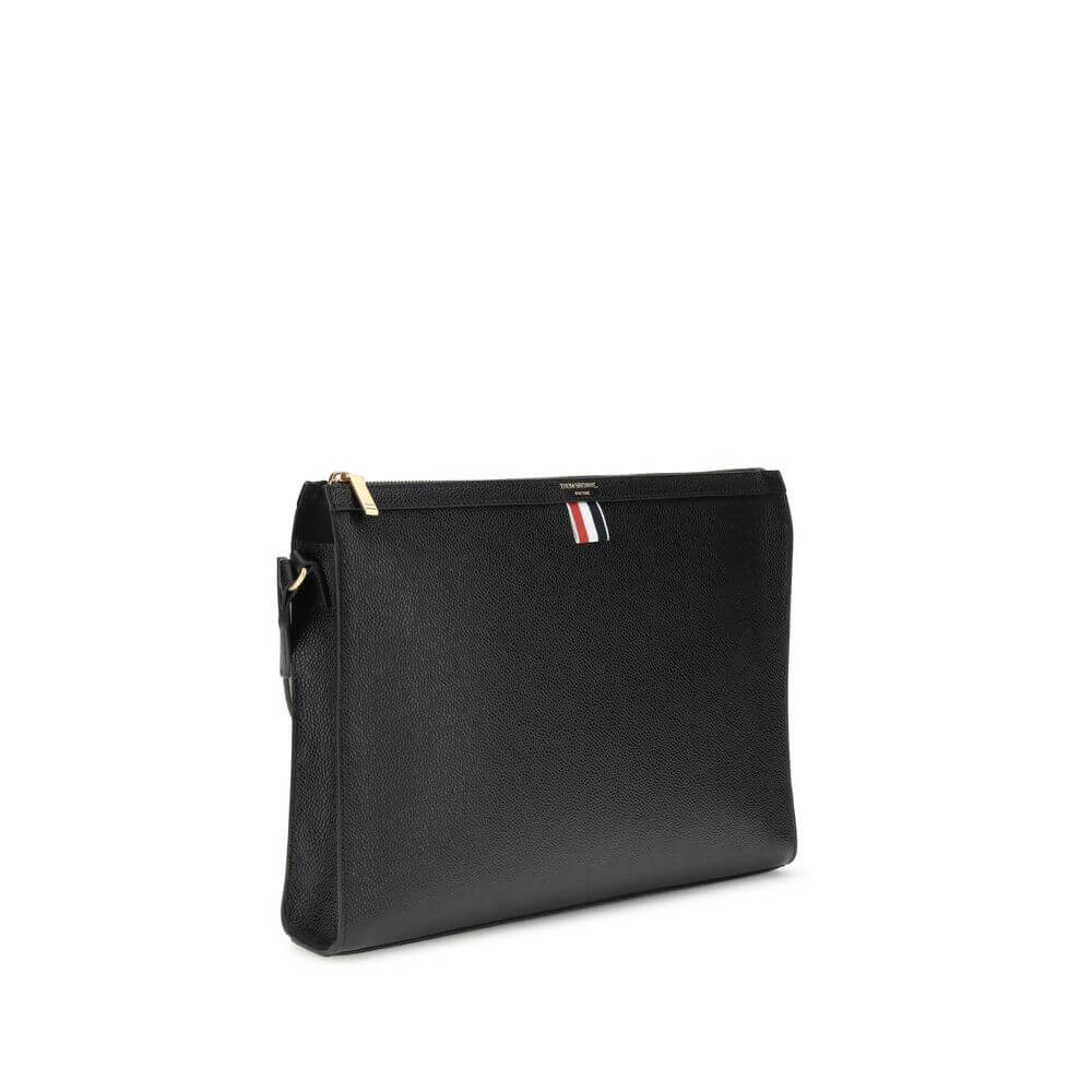 Thom Browne Black Calf Leather Bos Taurus Clutch Bag with iconic tricolor detail and top zipper closure, made in Italy, AW25.