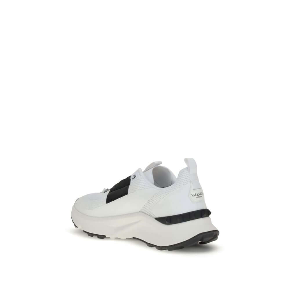 Valentino Garavani White Calf Leather Bos Taurus Athletic Sneakers back view with logo and rubber sole detailing.