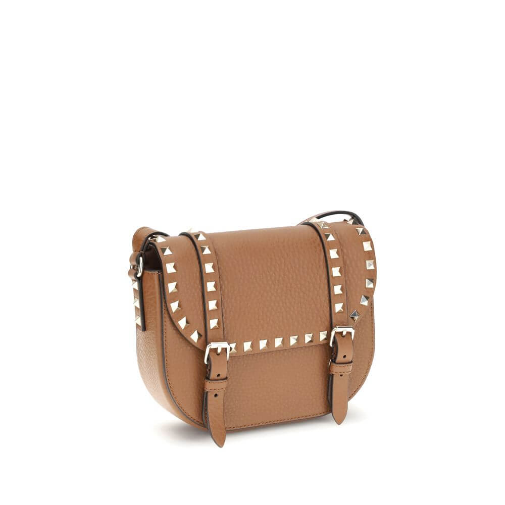 Valentino Garavani Beige Calf Leather Bos Taurus Shoulder Bag with iconic studs and adjustable strap, perfect for stylish looks.