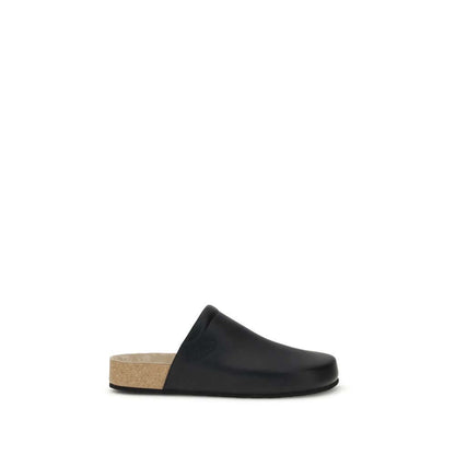 Balenciaga Black Calf Leather Bos Taurus Mules with cork sole, modern minimalist design, comfort leather upper, Made in Italy.