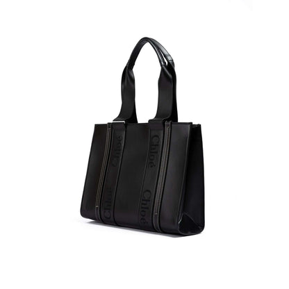 Chloé Black Woody Embroidered Logo Leather Medium Tote Bag featuring a sleek design, perfect for stylish everyday use.