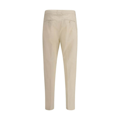 Back view of Cruna Beige Cotton Casual Pants with buttoned welt pockets and elastic waistband.